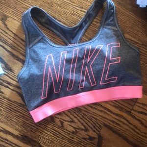 Gray Nike sports bra with coral writing